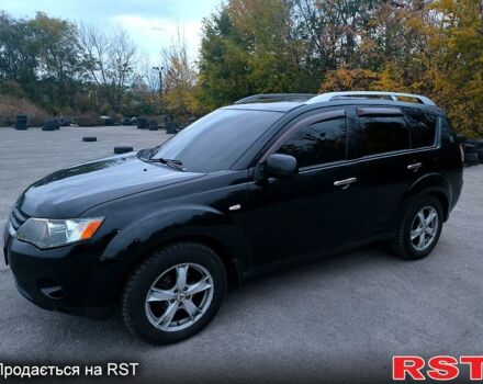 Черный Мицубиси Аутлендер, объемом двигателя 2.4 л и пробегом 210 тыс. км за 7800 $, фото 1 на Automoto.ua