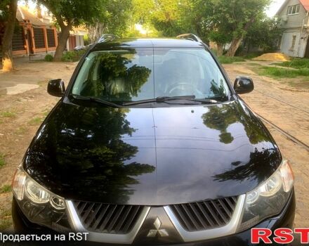 Черный Мицубиси Аутлендер, объемом двигателя 2.4 л и пробегом 230 тыс. км за 8500 $, фото 2 на Automoto.ua