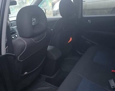 Черный Мицубиси Аутлендер, объемом двигателя 2.4 л и пробегом 270 тыс. км за 6700 $, фото 5 на Automoto.ua