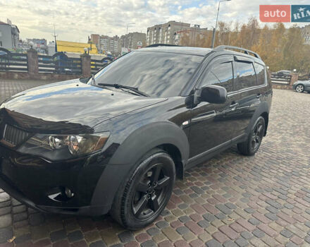Черный Мицубиси Аутлендер, объемом двигателя 2.4 л и пробегом 199 тыс. км за 8777 $, фото 1 на Automoto.ua