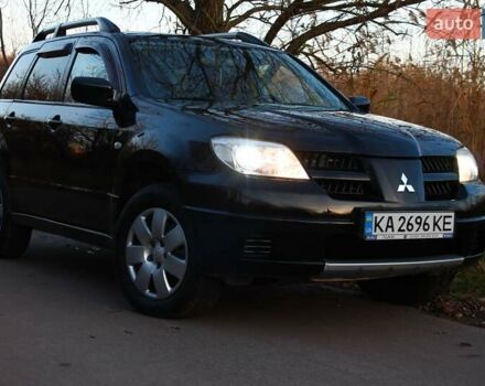Черный Мицубиси Аутлендер, объемом двигателя 2 л и пробегом 190 тыс. км за 6900 $, фото 3 на Automoto.ua
