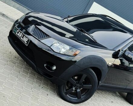 Черный Мицубиси Аутлендер, объемом двигателя 2.4 л и пробегом 199 тыс. км за 6470 $, фото 4 на Automoto.ua
