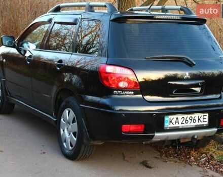 Черный Мицубиси Аутлендер, объемом двигателя 2 л и пробегом 190 тыс. км за 6900 $, фото 19 на Automoto.ua