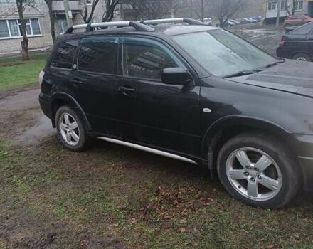 Черный Мицубиси Аутлендер, объемом двигателя 2.4 л и пробегом 270 тыс. км за 6700 $, фото 1 на Automoto.ua