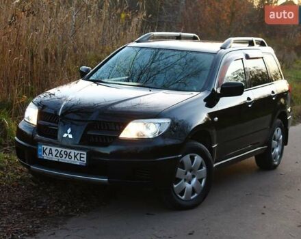 Черный Мицубиси Аутлендер, объемом двигателя 2 л и пробегом 190 тыс. км за 6900 $, фото 6 на Automoto.ua