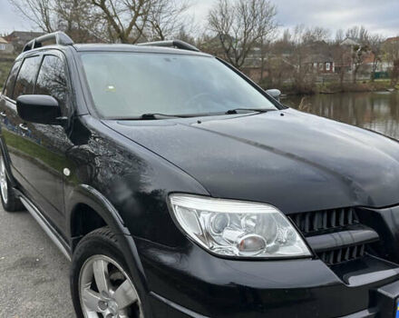 Чорний Міцубісі Аутлендер, об'ємом двигуна 2 л та пробігом 118 тис. км за 8100 $, фото 4 на Automoto.ua