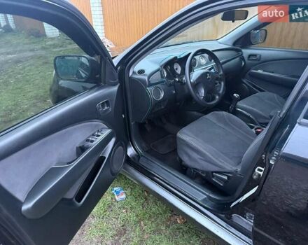 Черный Мицубиси Аутлендер, объемом двигателя 2 л и пробегом 232 тыс. км за 7000 $, фото 13 на Automoto.ua