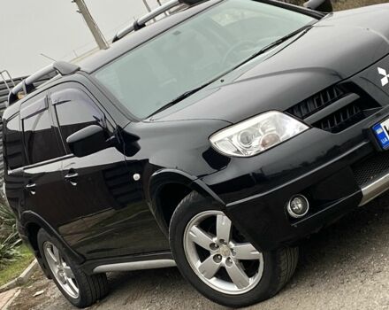 Черный Мицубиси Аутлендер, объемом двигателя 2.4 л и пробегом 178 тыс. км за 6900 $, фото 3 на Automoto.ua