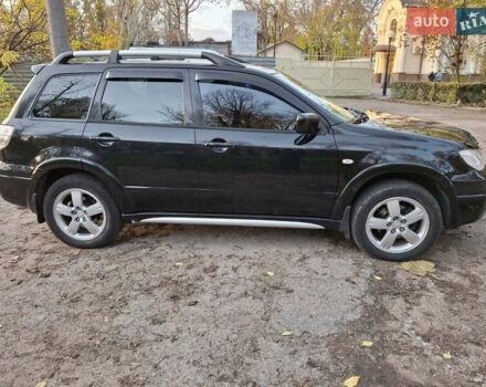 Чорний Міцубісі Аутлендер, об'ємом двигуна 2.38 л та пробігом 245 тис. км за 6800 $, фото 7 на Automoto.ua