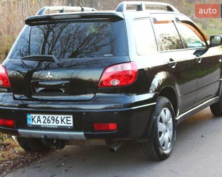 Черный Мицубиси Аутлендер, объемом двигателя 2 л и пробегом 190 тыс. км за 6900 $, фото 11 на Automoto.ua