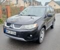 Черный Мицубиси Аутлендер, объемом двигателя 2 л и пробегом 226 тыс. км за 4700 $, фото 1 на Automoto.ua