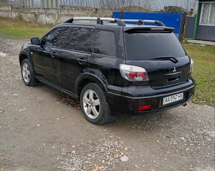 Черный Мицубиси Аутлендер, объемом двигателя 2 л и пробегом 209 тыс. км за 5700 $, фото 3 на Automoto.ua