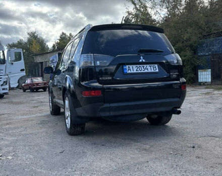 Черный Мицубиси Аутлендер, объемом двигателя 2.36 л и пробегом 286 тыс. км за 9200 $, фото 4 на Automoto.ua
