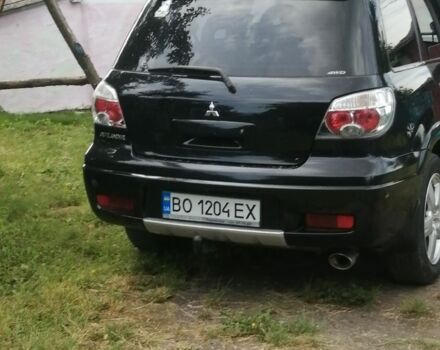 Чорний Міцубісі Аутлендер, об'ємом двигуна 2 л та пробігом 208 тис. км за 6700 $, фото 4 на Automoto.ua