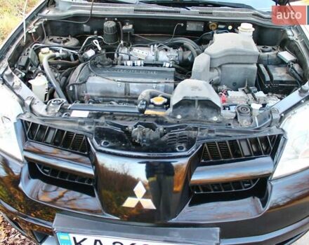 Черный Мицубиси Аутлендер, объемом двигателя 2 л и пробегом 190 тыс. км за 6900 $, фото 52 на Automoto.ua