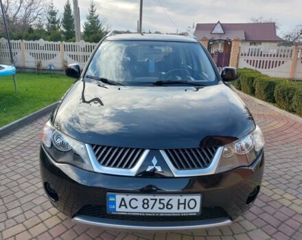 Черный Мицубиси Аутлендер, объемом двигателя 2 л и пробегом 249 тыс. км за 8750 $, фото 1 на Automoto.ua