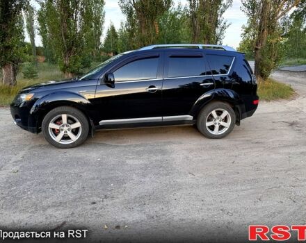 Черный Мицубиси Аутлендер, объемом двигателя 2.4 л и пробегом 208 тыс. км за 10200 $, фото 2 на Automoto.ua