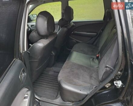 Чорний Міцубісі Аутлендер, об'ємом двигуна 2 л та пробігом 191 тис. км за 7100 $, фото 9 на Automoto.ua