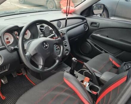 Черный Мицубиси Аутлендер, объемом двигателя 2 л и пробегом 212 тыс. км за 7900 $, фото 4 на Automoto.ua