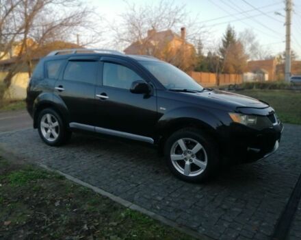 Черный Мицубиси Аутлендер, объемом двигателя 2.4 л и пробегом 228 тыс. км за 7850 $, фото 2 на Automoto.ua