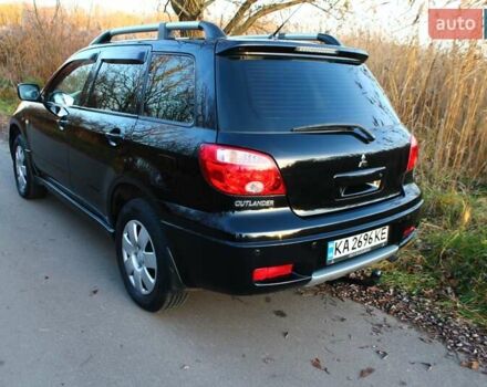 Черный Мицубиси Аутлендер, объемом двигателя 2 л и пробегом 190 тыс. км за 6900 $, фото 29 на Automoto.ua