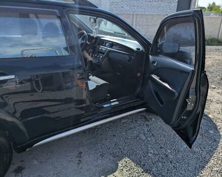 Черный Мицубиси Аутлендер, объемом двигателя 2 л и пробегом 189 тыс. км за 7100 $, фото 3 на Automoto.ua