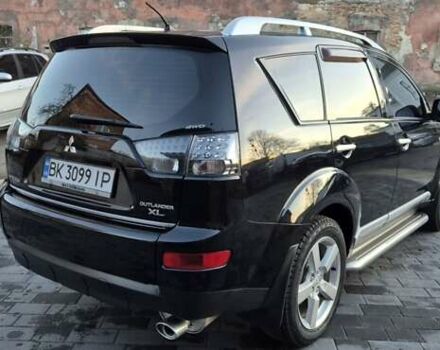 Чорний Міцубісі Аутлендер, об'ємом двигуна 2.4 л та пробігом 230 тис. км за 9700 $, фото 4 на Automoto.ua