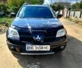 Чорний Міцубісі Аутлендер, об'ємом двигуна 2 л та пробігом 202 тис. км за 8000 $, фото 1 на Automoto.ua