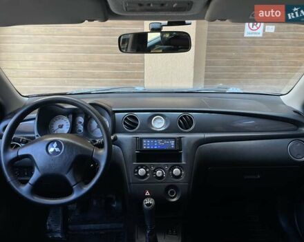 Черный Мицубиси Аутлендер, объемом двигателя 2 л и пробегом 270 тыс. км за 7199 $, фото 1 на Automoto.ua