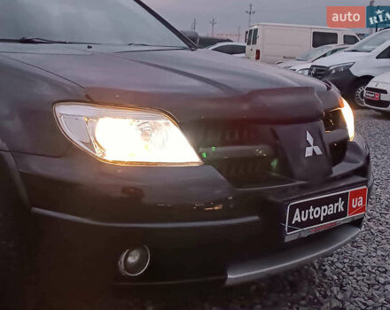 Чорний Міцубісі Аутлендер, об'ємом двигуна 2 л та пробігом 271 тис. км за 6940 $, фото 13 на Automoto.ua