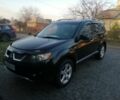 Черный Мицубиси Аутлендер, объемом двигателя 2.4 л и пробегом 228 тыс. км за 7850 $, фото 1 на Automoto.ua