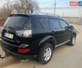 Черный Мицубиси Аутлендер, объемом двигателя 2.4 л и пробегом 290 тыс. км за 8600 $, фото 4 на Automoto.ua