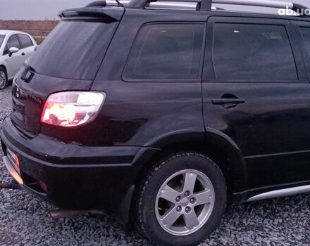 Черный Мицубиси Аутлендер, объемом двигателя 2 л и пробегом 271 тыс. км за 6940 $, фото 8 на Automoto.ua