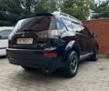 Черный Мицубиси Аутлендер, объемом двигателя 2.4 л и пробегом 156 тыс. км за 8500 $, фото 1 на Automoto.ua
