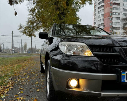 Чорний Міцубісі Аутлендер, об'ємом двигуна 2 л та пробігом 254 тис. км за 7499 $, фото 5 на Automoto.ua