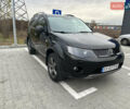 Чорний Міцубісі Аутлендер, об'ємом двигуна 2.4 л та пробігом 218 тис. км за 10000 $, фото 1 на Automoto.ua