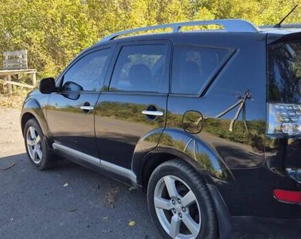 Черный Мицубиси Аутлендер, объемом двигателя 2.4 л и пробегом 178 тыс. км за 9150 $, фото 2 на Automoto.ua