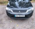 Черный Мицубиси Аутлендер, объемом двигателя 2.4 л и пробегом 208 тыс. км за 8600 $, фото 1 на Automoto.ua