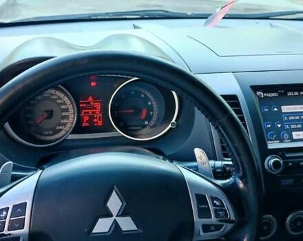 Черный Мицубиси Аутлендер, объемом двигателя 2.36 л и пробегом 246 тыс. км за 9700 $, фото 4 на Automoto.ua