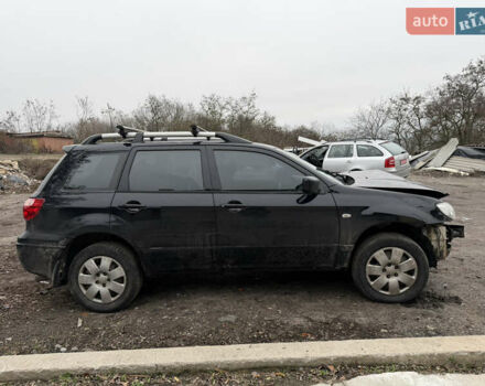Черный Мицубиси Аутлендер, объемом двигателя 2 л и пробегом 200 тыс. км за 2999 $, фото 2 на Automoto.ua
