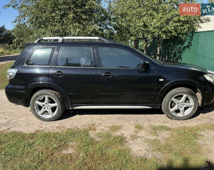 Міцубісі Аутлендер 2008 у Києві на Automoto.ua Чорний Міцубісі Аутлендер, об'ємом двигуна 2 л та пробігом 228 тис. км за 7300 $, фото 5 на Automoto.ua