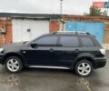 Черный Мицубиси Аутлендер, объемом двигателя 2 л и пробегом 306 тыс. км за 6500 $, фото 1 на Automoto.ua