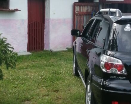 Чорний Міцубісі Аутлендер, об'ємом двигуна 2 л та пробігом 208 тис. км за 6700 $, фото 3 на Automoto.ua