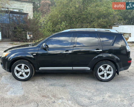 Черный Мицубиси Аутлендер, объемом двигателя 2.36 л и пробегом 286 тыс. км за 9200 $, фото 3 на Automoto.ua