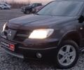 Черный Мицубиси Аутлендер, объемом двигателя 2 л и пробегом 271 тыс. км за 6940 $, фото 1 на Automoto.ua