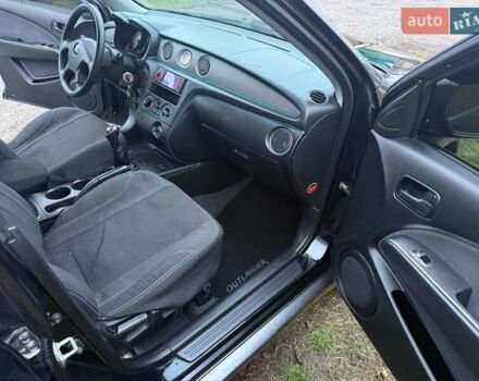 Черный Мицубиси Аутлендер, объемом двигателя 2 л и пробегом 232 тыс. км за 7000 $, фото 6 на Automoto.ua