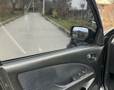 Чорний Міцубісі Аутлендер, об'ємом двигуна 2 л та пробігом 118 тис. км за 8100 $, фото 28 на Automoto.ua