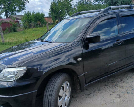 Чорний Міцубісі Аутлендер, об'ємом двигуна 2 л та пробігом 161 тис. км за 7499 $, фото 8 на Automoto.ua