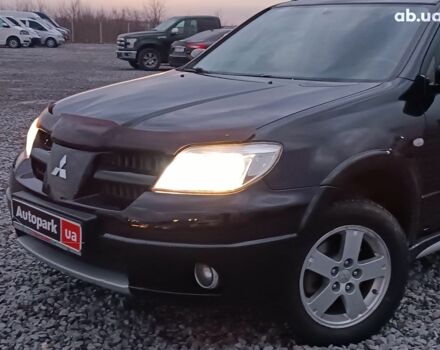 Черный Мицубиси Аутлендер, объемом двигателя 2 л и пробегом 271 тыс. км за 6940 $, фото 1 на Automoto.ua