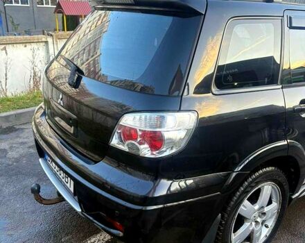 Черный Мицубиси Аутлендер, объемом двигателя 2.4 л и пробегом 231 тыс. км за 8500 $, фото 4 на Automoto.ua